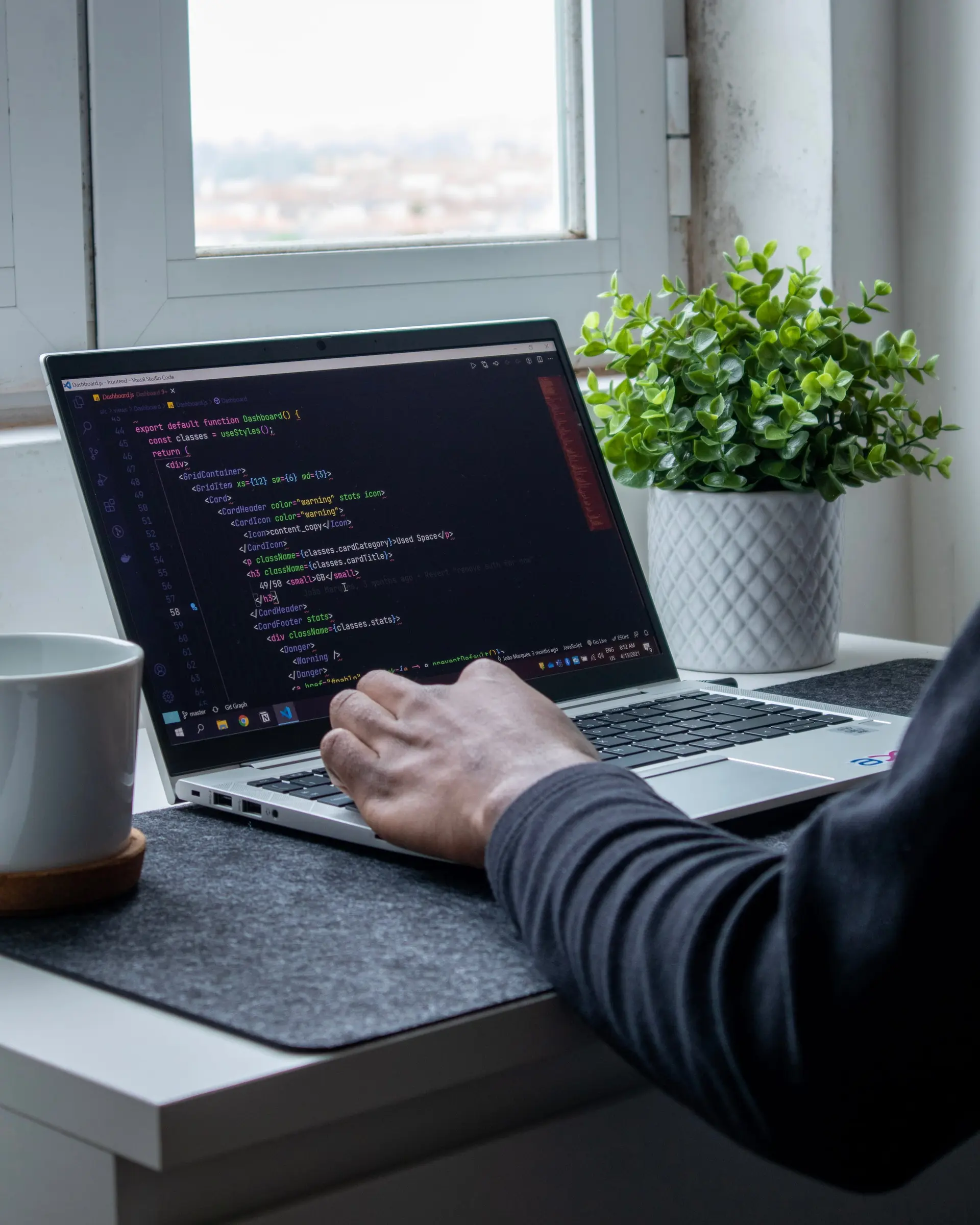 A business owner working at a laptop